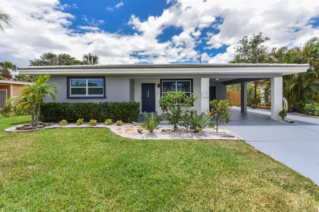 Photo of 140 Date Palm Drive, Lake Park, FL 33403 (MLS # R10799079)