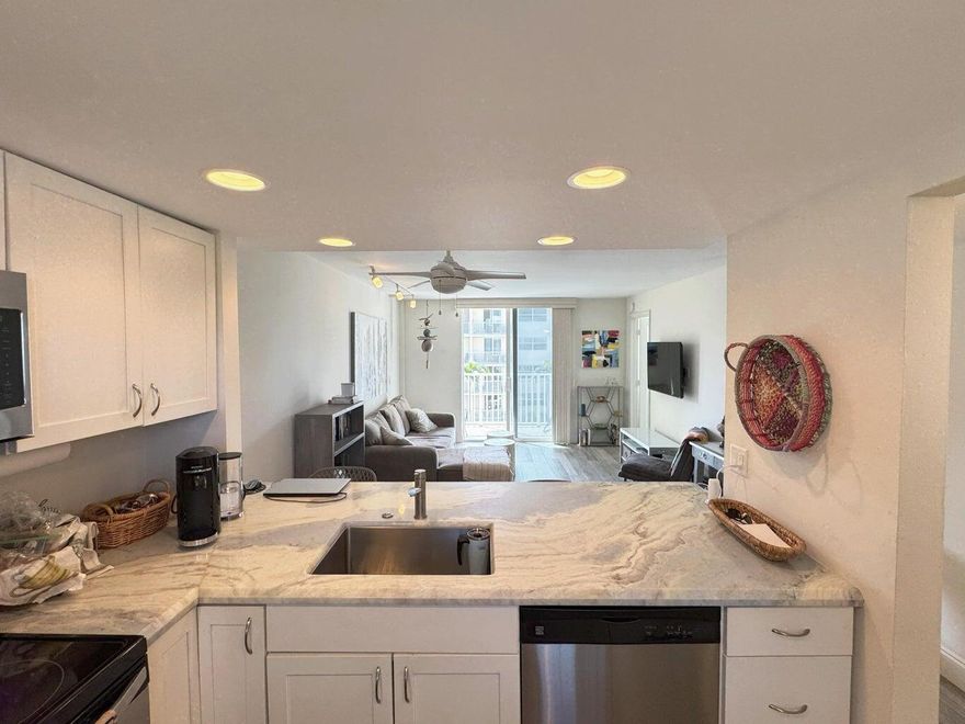 Looking for a beachy getaway with a touch of luxury? This updated condo has it all! Step into a spacious bedroom with a walk-in closet, and enjoy a gorgeous tile walk-in shower that's perfect for unwinding. The open kitchen with stainless steel appliances makes cooking a breeze, and the balcony--overlooking the pool with a partial ocean view--has sunrise vibes written all over it. Just a short stroll to the beach and Deerfield Pier, where you can grab a bite at JB's on the Beach or The Whale's Rib (yes, *that* one from Guy Fieri's *Diners, Drive-Ins & Dives*!). It's laid-back living with a side of flavor--Don't miss out! **Available from 3/28/26 until December 2026**