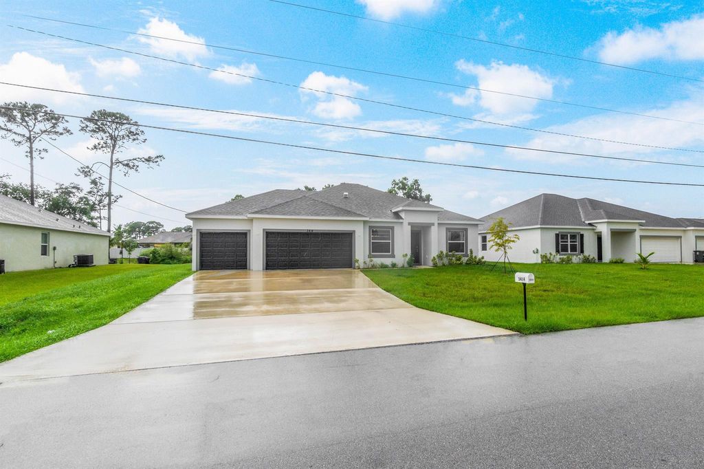 Photo of 3414 SW Martin Street, Port St Lucie, FL 34953 (MLS # R10923458)