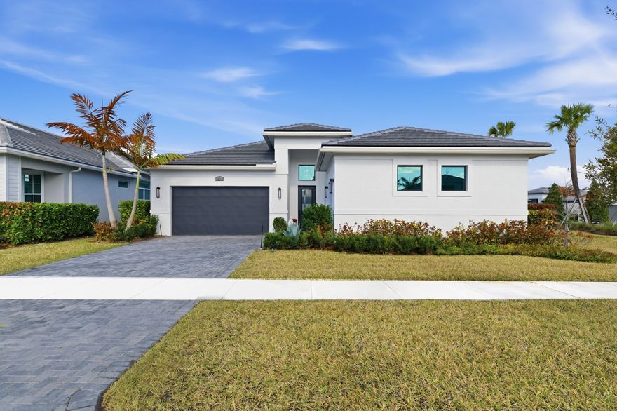 When lifestyle and luxury collide, you discover this exceptional corner residence in the most desirable area of Port St. Lucie. Featuring 4 Bedrooms, 4 1/2 Baths, this home offers the perfect blend of elegance, comfort, and prime location—just minutes from top dining, shopping, golf, and beaches. From the moment you enter, you're captivated by curated interiors with custom Restoration Hardware finishes throughout. Built with the Builder highest upgrade package, every detail has been elevated, including designer lighting and fixtures. Each spacious bedroom features a private en-suite bath, while the secluded owner's suite provides a serene retreat. The chef's kitchen with a grand island and walk-through pantry creates the ultimate space for entertaining and everyday luxury living. This community offers resort-style living with a modern clubhouse, EGYM fitness center, group classes, dining, and a poolside bar. Enjoy pickleball, tennis, basketball, and a full calendar of events. This vibrant community delivers luxury amenities, active living, and year-round recreation for all ages.