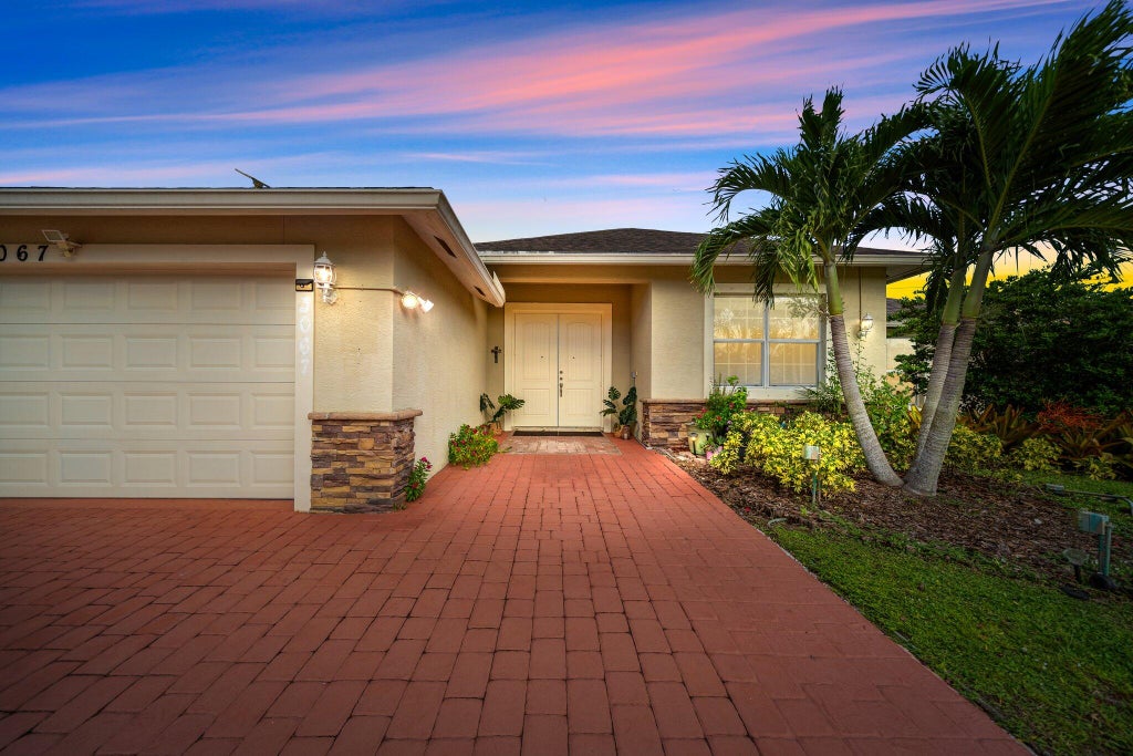 Photo of 3067 SW Segovia Street, Port Saint Lucie, FL 34953 (MLS # R10896915)