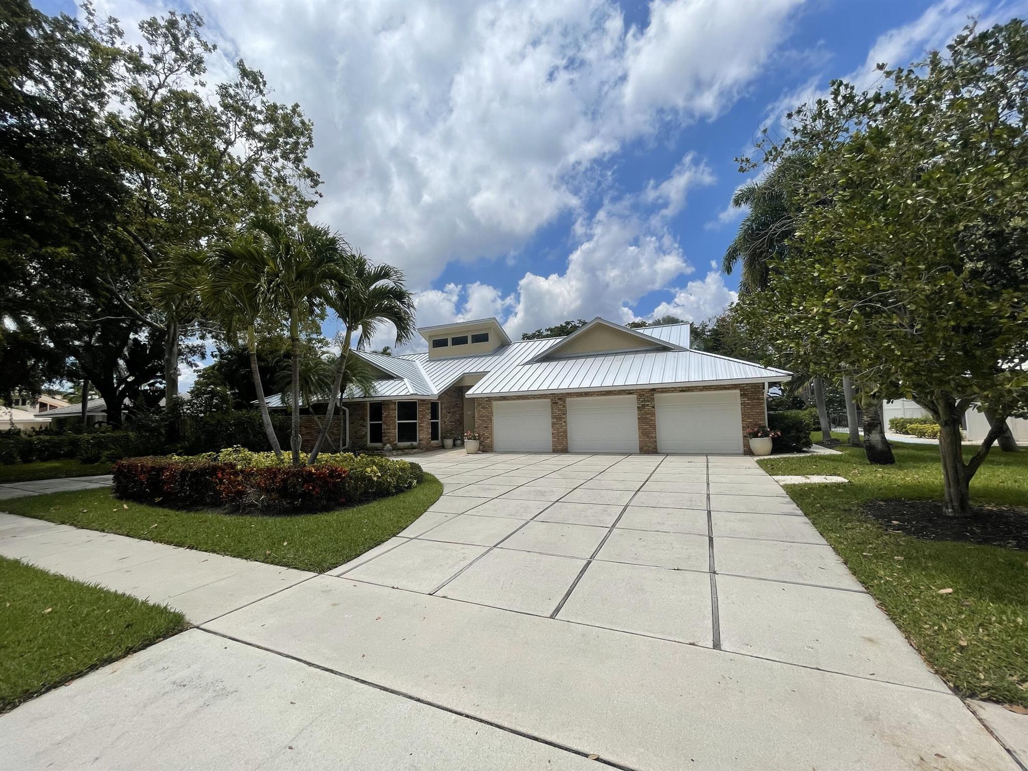 The home you have been waiting for in Boca Bath & Tennis is now available. It is your opportunity to live in one of the most sought-after Central Boca Neighborhoods, and it is a NON-EQUITY community! Upon entering this spacious and bright home you will find a well-designed totally renovated, six bedrooms, plus den, four and half baths, 4,336 SF Under Air and 5751 SF in total home, including the large three car garage. It has a modern floor plan with a large open living area, vaulted ceilings, family room, formal dining room and eat-in-kitchen. Large master bedroom suite with a pool access and view, walk-in closet, and huge bathroom. Expansive kitchen w/Miele cooktop and dishwasher, fireplace, and direct access to the salt water pool with a travertine paved pool deck.