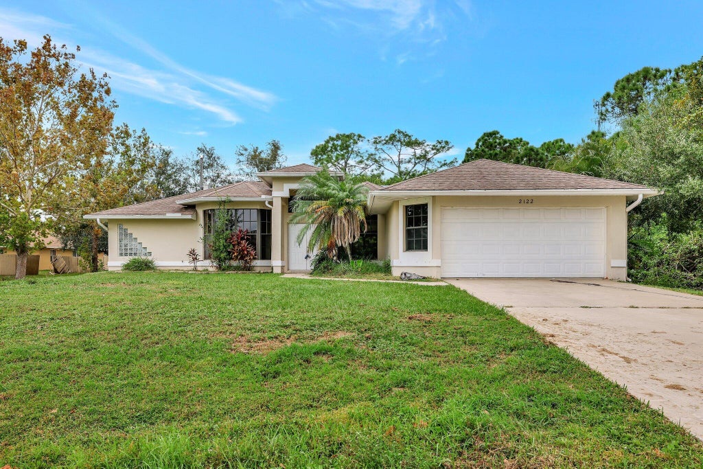 Photo of 2122 SW Burman Lane, Port Saint Lucie, FL 34983 (MLS # R11031686)