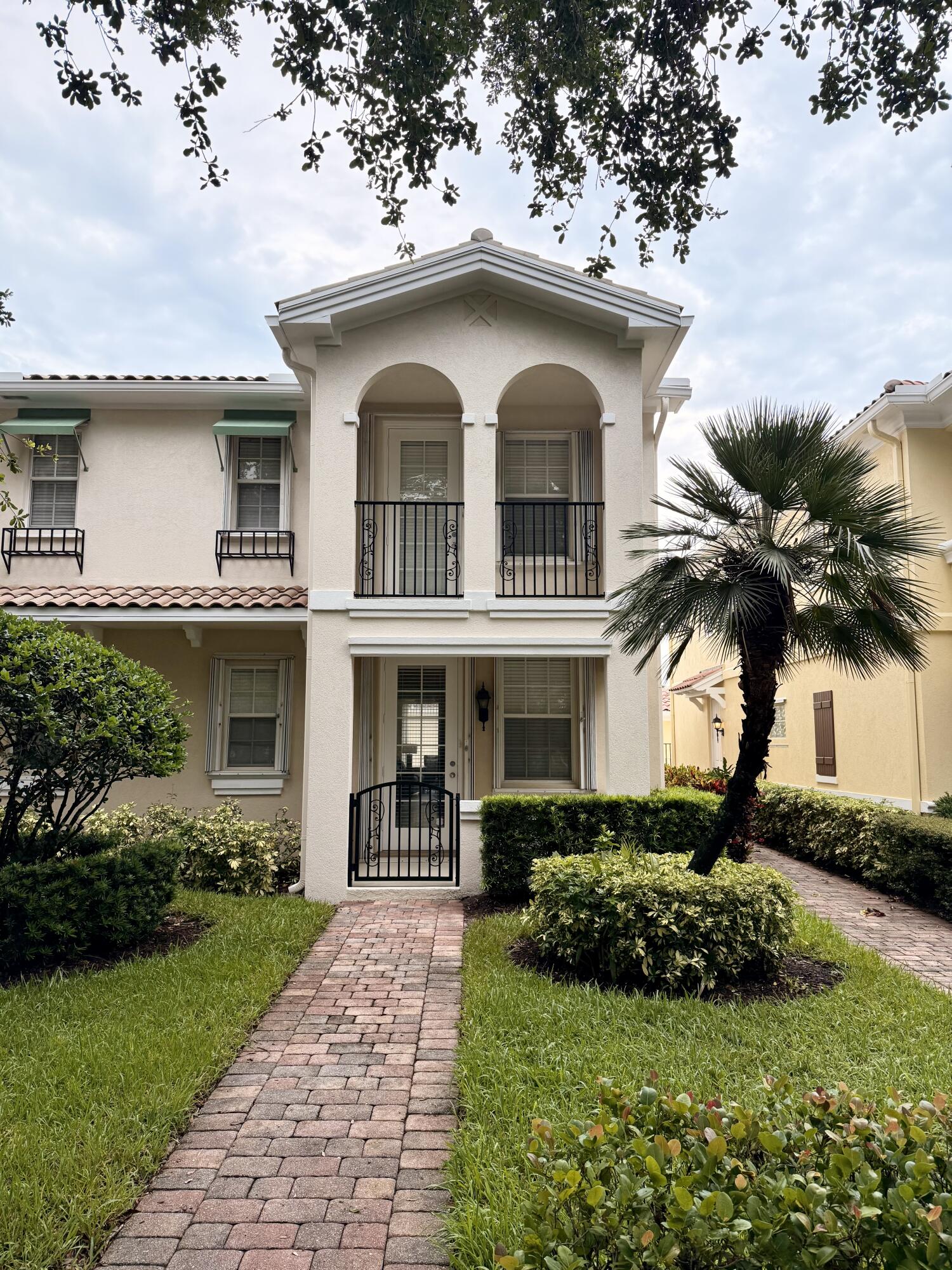 Welcome to 1609 Jeaga Drive, a distinguished residence located in the serene community of Tuscany at Abacoa, Jupiter, FL. This Mediterranean-style townhome offers a spacious and thoughtfully designed 1,830 square feet of living space, featuring four generously sized bedrooms and three well-appointed bathrooms, ideal for refined living.Upon entering, you will be greeted by sophisticated 18-inch diagonal tile flooring and elegant crown molding that enhance the home's aesthetic. The master bathroom is equipped with a luxurious whirlpool tub, providing a perfect retreat. Practical features such as a central vacuum system and accordion shutters add convenience and security to your lifestyle.The exterior of the home is equally inviting, boasting a private heated pool and a screened