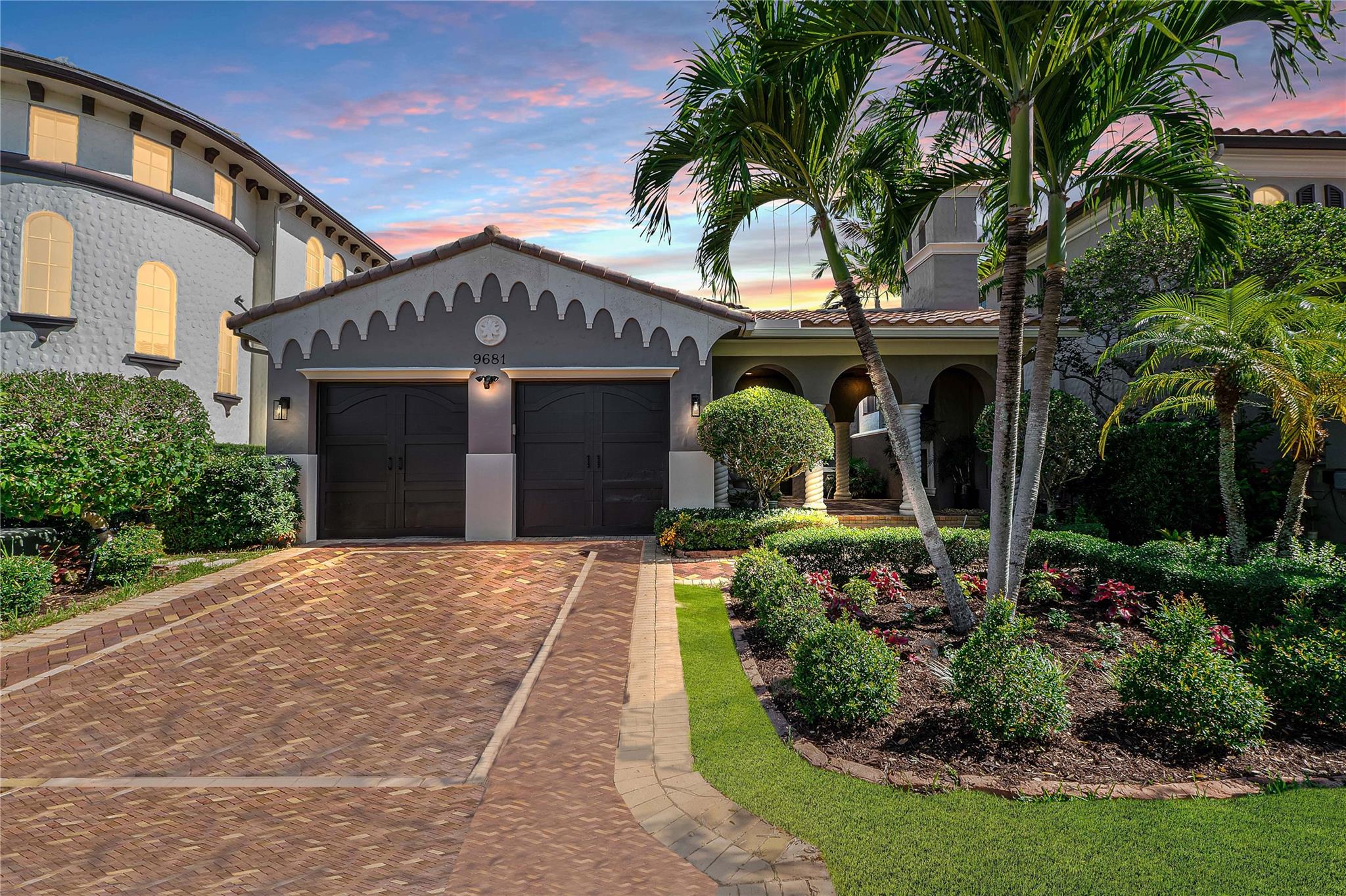 Beautiful 3-bedroom, 3-bath home located on a quiet cul-de-sac in Parkland Golf. Features outdoor fireplace at entrance, marble floors & thoughtful designer touches throughout. All impact glass, plantation shutters, & motorized blinds add style & security. Open floor plan, with spacious kitchen overlooking large family room with tons of natural light. The beautiful primary suite includes two custom closets & an enhanced bathroom with separate vanity area. Home boasts two additional bedroom suites, including one with attached bathroom. Enjoy outdoor Florida living with a covered patio & pool complete with lush landscaping—perfect for relaxing or entertaining. NEW W/H & A/C, NEW MONITORED FIRE ALARM SYSTEM, NEW POOL PUMP & WATER FILTER, EV CHARGING OUTLET, ALL NEW LED LIGHTS, FINISHED GARAGE