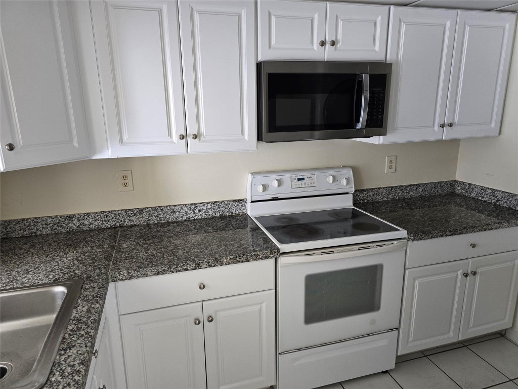 Photo of 10050 Winding Lake Road #103, Sunrise, FL 33351 (MLS # B26014826)