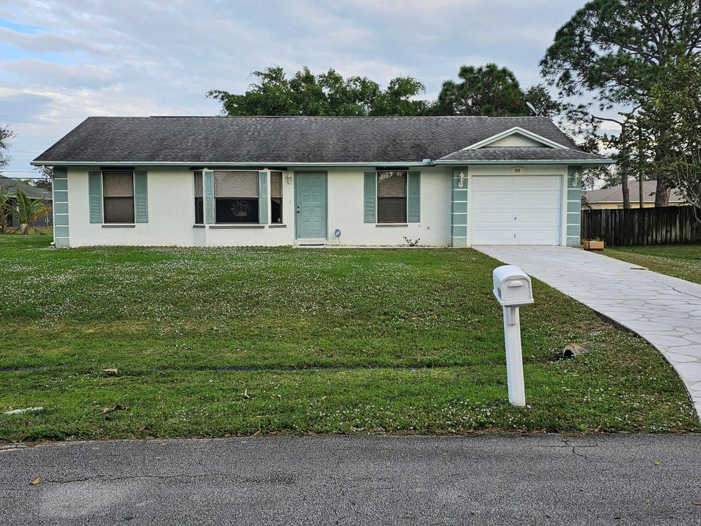 Photo of 309 NW Hogan Street, Port Saint Lucie, FL 34983 (MLS # R10950823)