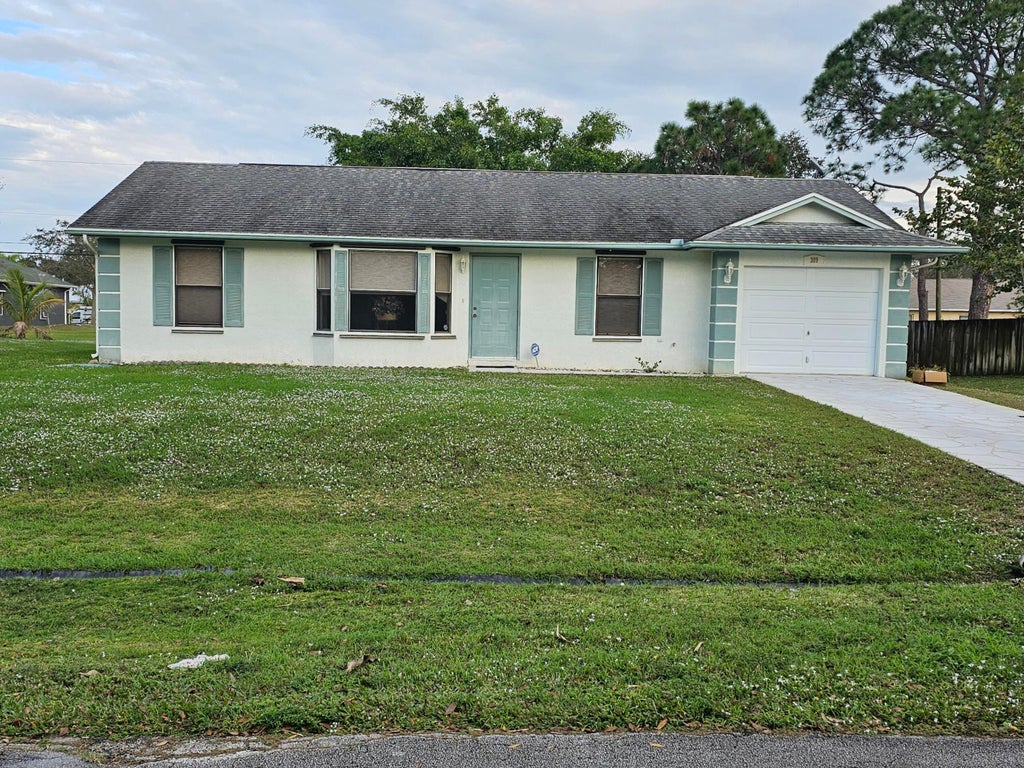 Photo of 309 NW Hogan Street, Port Saint Lucie, FL 34983 (MLS # R10950823)