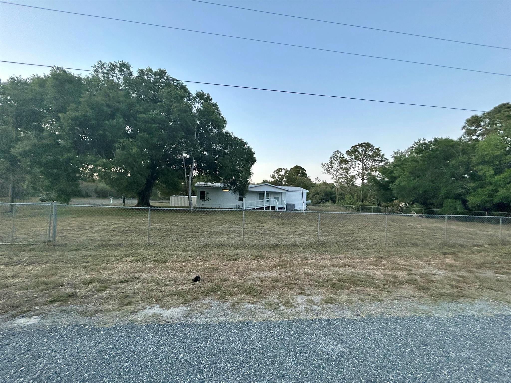 This generous home features three bedrooms and three bathrooms, along with an extra living area that can serve as a rental or a mother-in-law suite. Nestled on nearly an acre of fully fenced land, it offers a safe environment for your pets and showcases lovely oak trees throughout the property.