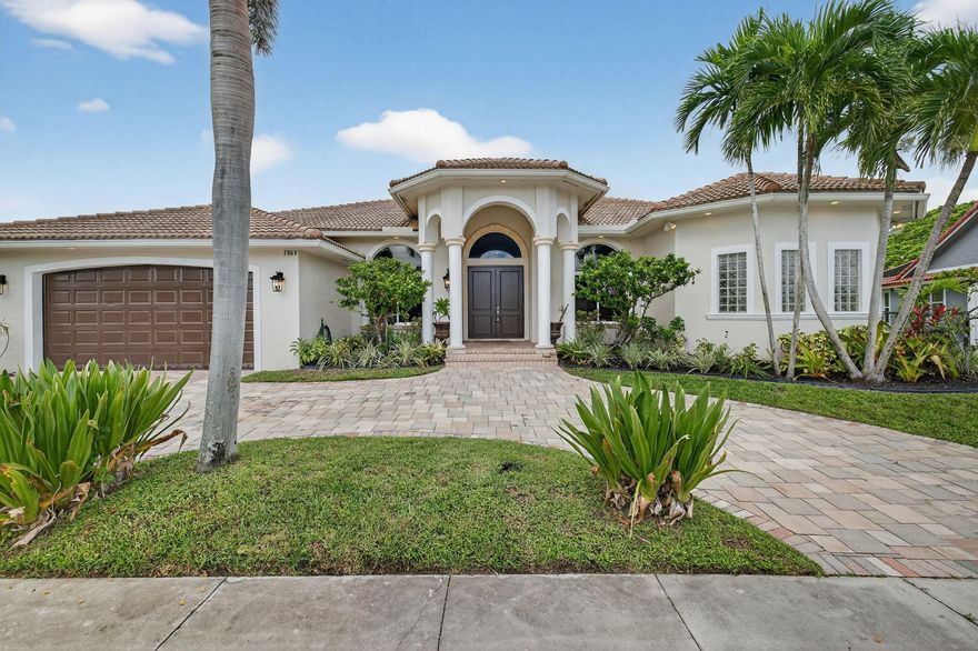 Waterfront living on a tranquil canal. This 4BR + office, 3BA residence showcases 12-ft ceilings, Brazilian cherry wood and travertine floors. A refined primary suite features a coffered ceiling and spa-style bath with jacuzzi tub. Entertain in the open living areas and step out to a backyard with saltwater pool, covered patio, and hookups for an outdoor kitchen—pre-wired for TV and stereo. Two A/C units (one new 2024) for efficient comfort. Lush coconut and banana trees complete the tropical setting. A rare blend of luxury and lifestyle—see it today.