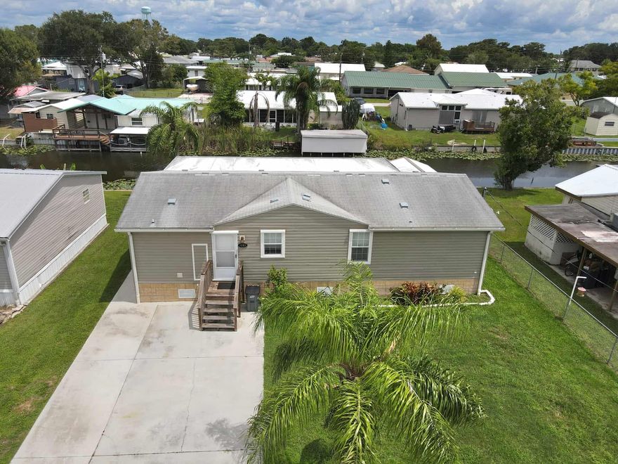 ~Fishermans Paradise~ This huge charming 3 bedroom/2 bath home is very spacious featuring an open floor plan, crown molding and laminate floors throughout. A HUGE 42X12 Florida room overlooking the freshwater canal. Good seawall and a shed for storage. Dock with a fish cleaning table so you can fish in your own backyard. Just minutes from the lock to Beautiful Lake Okeechobee. Call for your appointment today. All measurements are approximate.