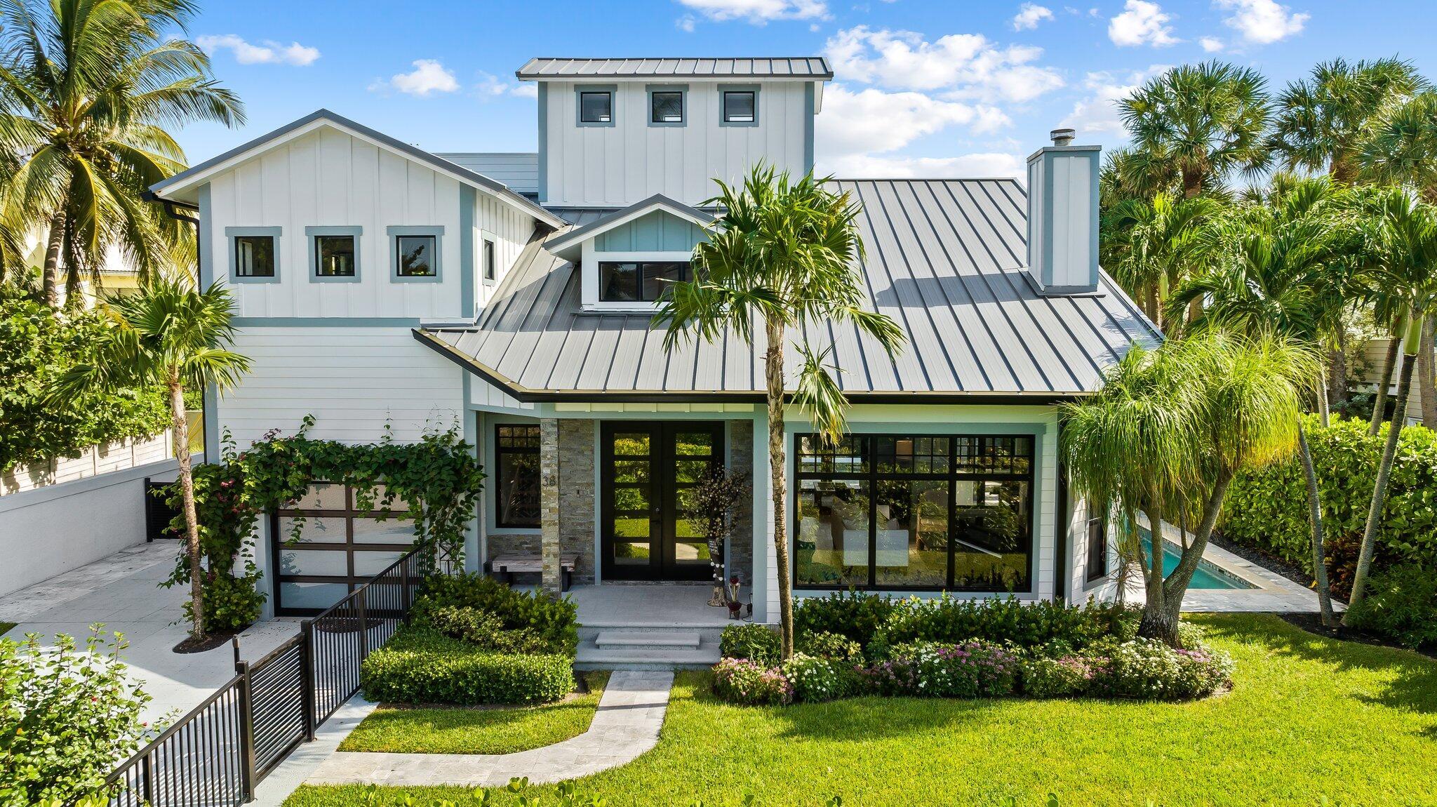 Nestled in the quiet town of Ocean Ridge just step from the beach. This 3 bedroom 2.5 bath home has everything you need for enjoying the Florida lifestyle. Located on a cul de sac with private beach access. Home was renovated in 2021 with state of the art finishes. Designed for outdoor living with a heated pool, summer kitchen, outdoor shower and private patio. Lushly landscaped for a tropical feel. A private roof top deck allows for morning sunrises.