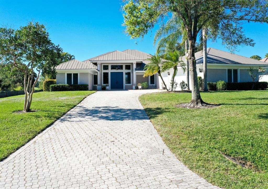 Photo of 884 SW Squire Johns Lane, Palm City, FL 34990 (MLS # R10877439)