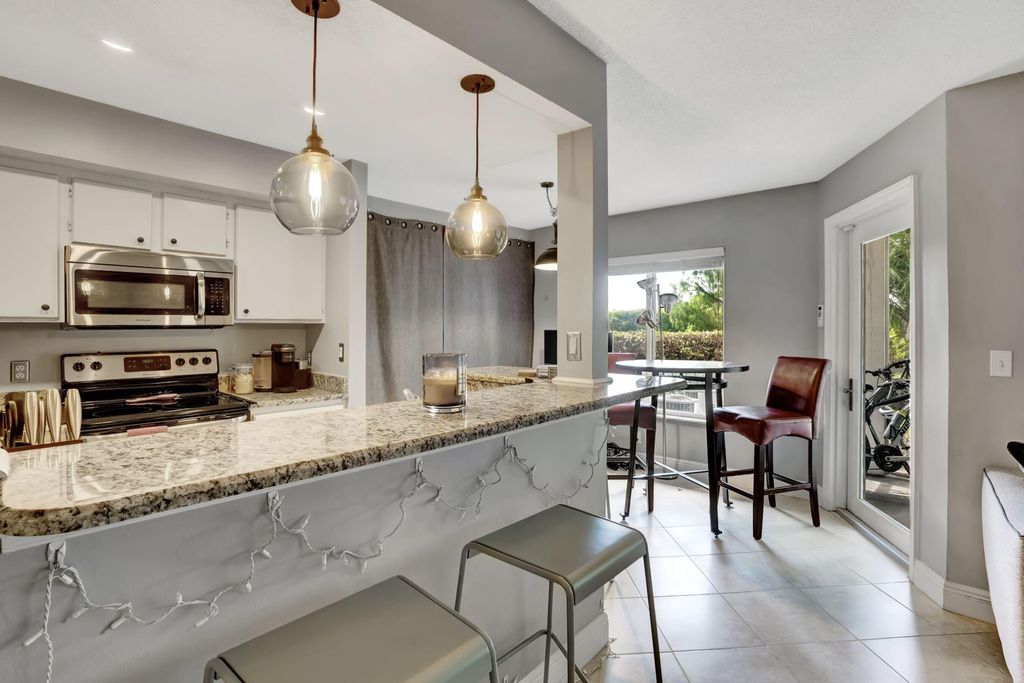 Photo of 815 W Boynton Beach Boulevard #6-104, Boynton Beach, FL 33426 (MLS # R10961252)