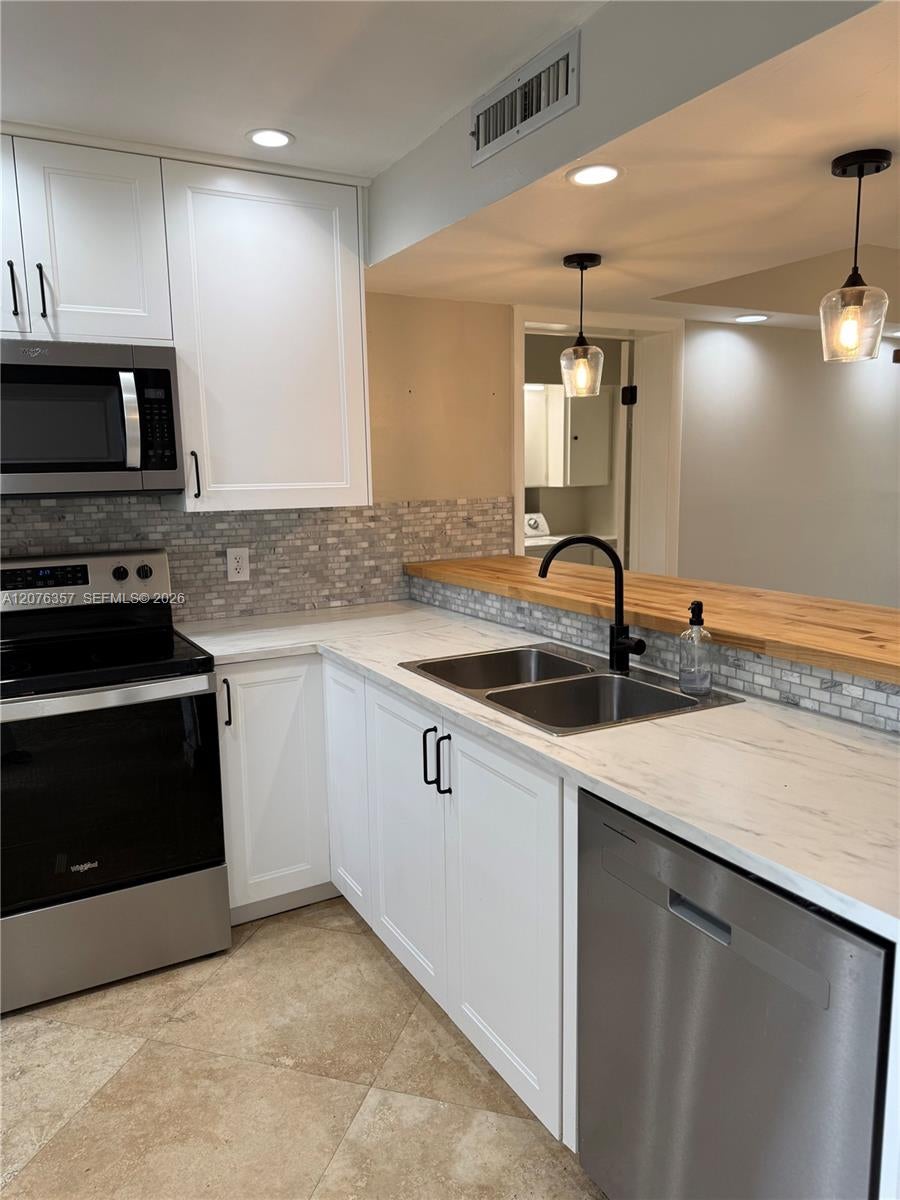 Photo of 1520 Whitehall Drive #206, Davie, FL 33324 (MLS # A12076357)