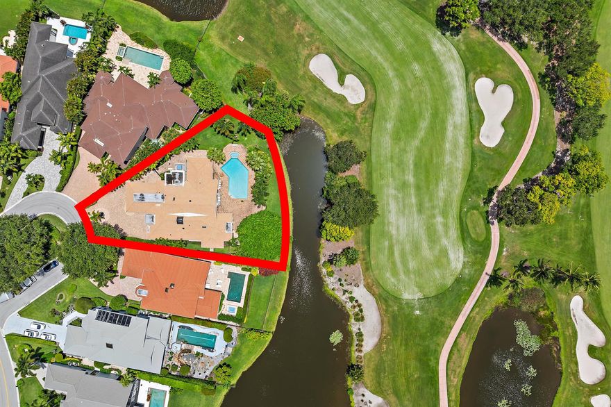 Tucked inside the gates of Frenchman's Creek, this custom single-story estate delivers timeless elegance, serene golf course views, and the kind of amenities only a premier country club community can offer. Surrounded by lush landscaping and set on an oversized lot, the home offers a rare sense of privacy while still being moments from world-class golf, tennis, the private beach club, and marina.With over 4,100 square feet of living space, this 4 bedroom, 4 bath residence balances grand scale with thoughtful design. Marble floors, soaring ceilings, and curated finishes set the tone, while the chef's kitchen features Sub-Zero and Thermador appliances, and a six-burner gas range. The layout flows seamlessly from the great room to a sunlit breakfast area and out to the