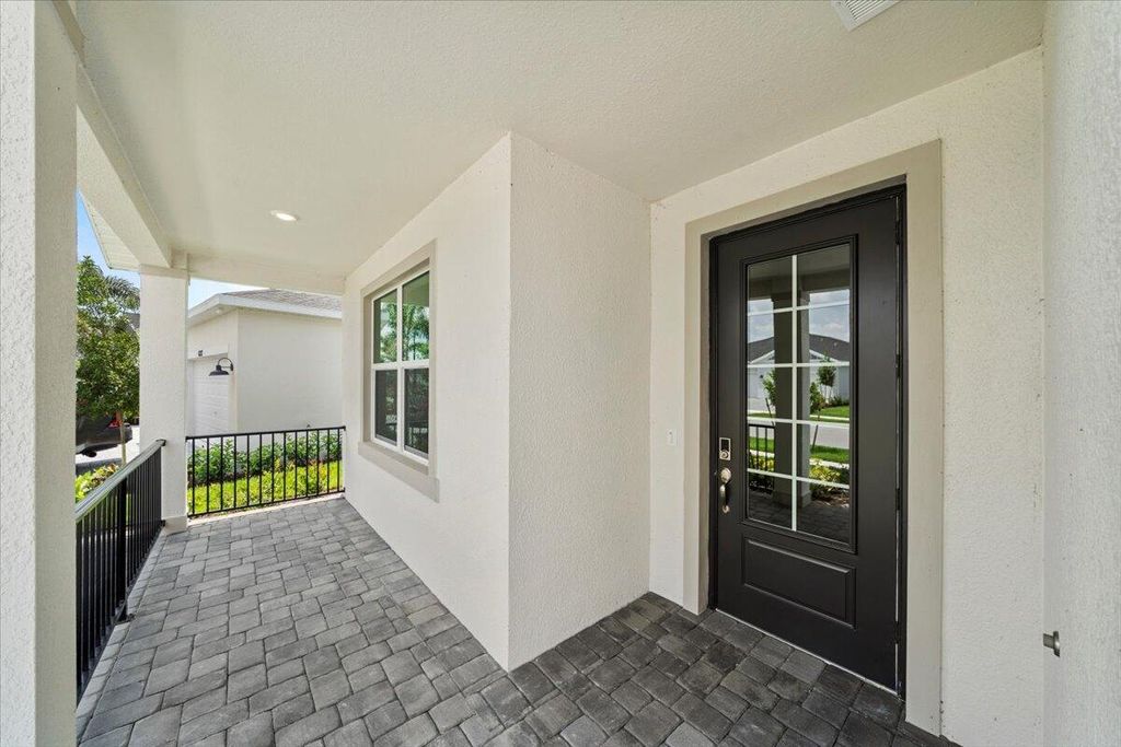 Photo of 6295 NW Sweetwood Drive, Port Saint Lucie, FL 34987 (MLS # R10990846)