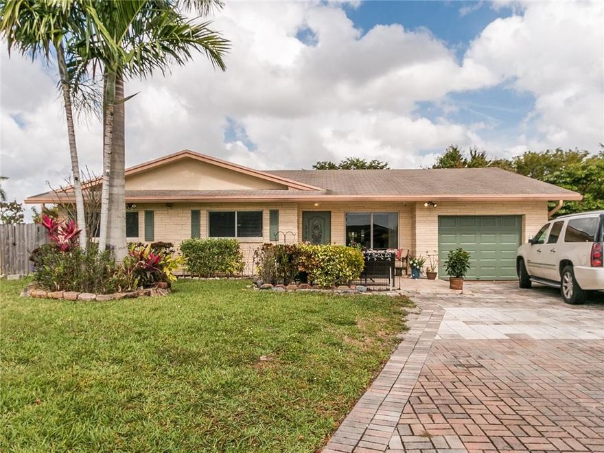 WELCOME HOME TO THIS TROPICAL PARADISE - A TRUE 4/2 OPEN FLOOR PLAN BRIGHT AND AIRY WITH LOTS OF NATURAL LIGHT. HUGE RENOVATED KITCHEN WITH STAINLESS APPLIANCES AND GRANITE COUNTER TOPS. AMAZING DIVING POOL ON A 10,000+ SQUARE FOOT WATERFRONT LOT. NEW FENCE AND YARD ADORNED WITH FRUIT TREES AND HAS ROOM FOR RV/BOAT. EXTRA LARGE DRIVEWAY LEADS TO A QUAINT FRONT PORCH. INTERIOR BOASTS TILE THROUGHOUT AND NEWLY RENOVATED SPACIOUS BATHS, MASTER BATH IS AN EN-SUITE AND HAS HUGE CLOSET. FRENCH DOORS LOOK OUT TO BEAUTIFUL POOL AND WATER VIEW. IMPACT WINDOWS THROUGHOUT. SPACIOUS ENCLOSED AND AIR CONDITIONED FLORIDA ROOM. PRIDE OF OWNERSHIP - 24 HOUR NOTICE TO SHOW - OWNER OCCUPIED