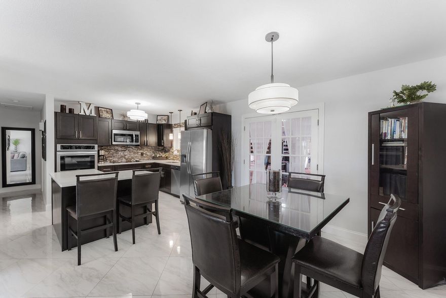 Ideally located EAST OF I-95 with NO HOA in the coveted Tropic Palms neighborhood! This beautifully renovated, impeccably maintained home offers ultimate flexibility just minutes from Delray's beaches and Atlantic Avenue. The main residence features 2 bedroom/ 1 bathroom plus a large versatile flex space ideal for an office or 3rd bedroom. An attached, fully private 1-bed, 1-bath suite with its own private entrance and outdoor sitting area offers the perfect setup for Next-Gen living or generating lucrative rental income. Unwind in a private, relaxing, maintenance-free backyard featuring premium artificial turf, surrounded by full hurricane impact protection. Bring your toys, your pets, and enjoy unrestricted freedom in East Delray!