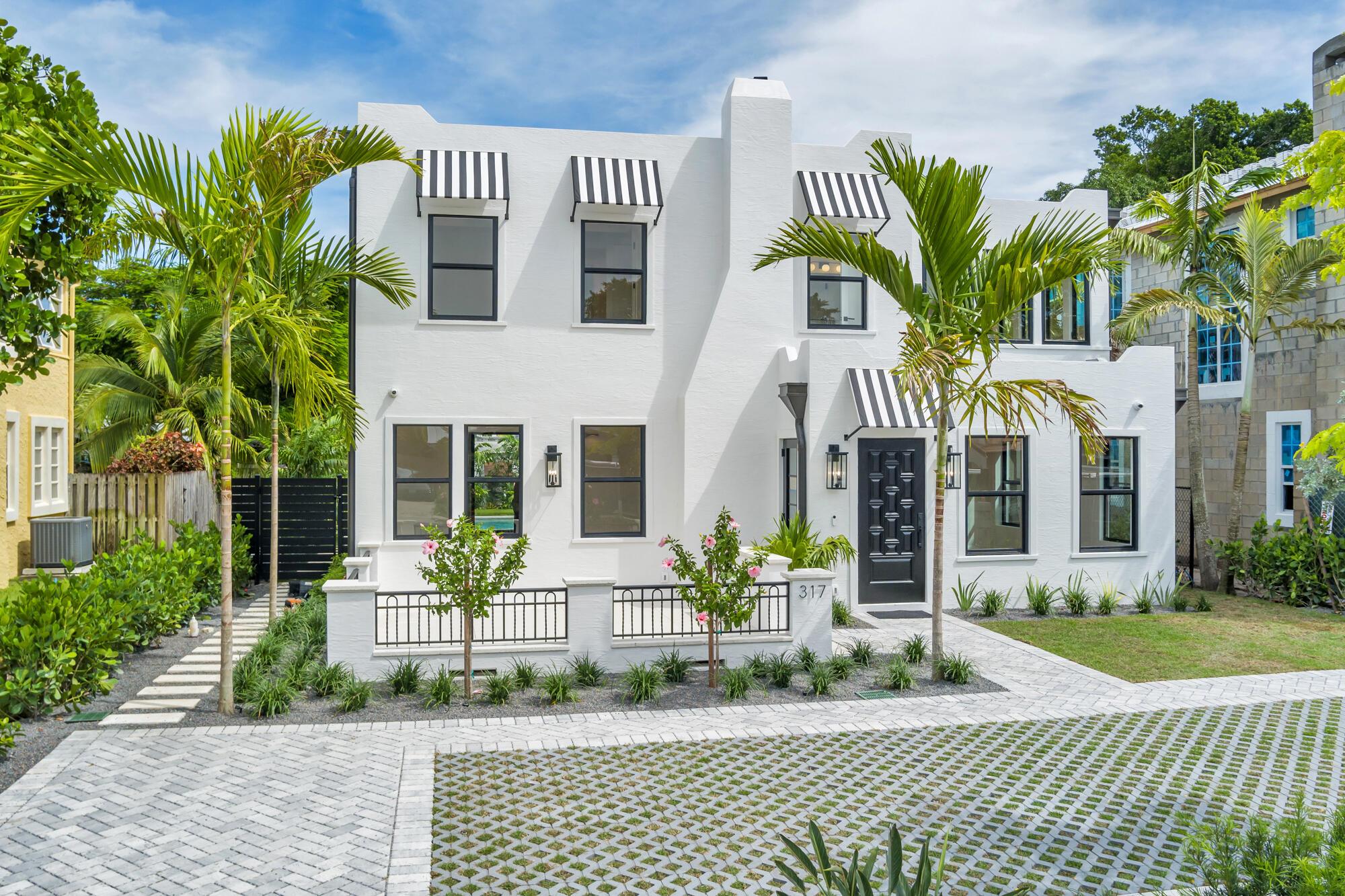 Historic charm meets 2025 renovation/ addition. Boasting 3,942 sq. ft. highlighting 4 bedrooms, 4.5 bathrooms and a designated office, this new construction historic remodel is a showstopper! New everything yet still considered ''historic,'' this home comes with a 10-year tax abatement! Not only are you buying a ''new'' home, but you also get the tax benefits from the developer keeping the ''history'' of the home intact. New plumbing, electrical, impact rated windows and doors, white oak floors, kitchen cabinets and appliances, bathrooms, swimming pool and summer kitchen. NEW! NEW! NEW! Featuring a coveted paved/ grassed driveway, with a fully landscaped yard, this home's curb appeal is next level! Walking through the front door, one immediately notices the attention to detail with the w