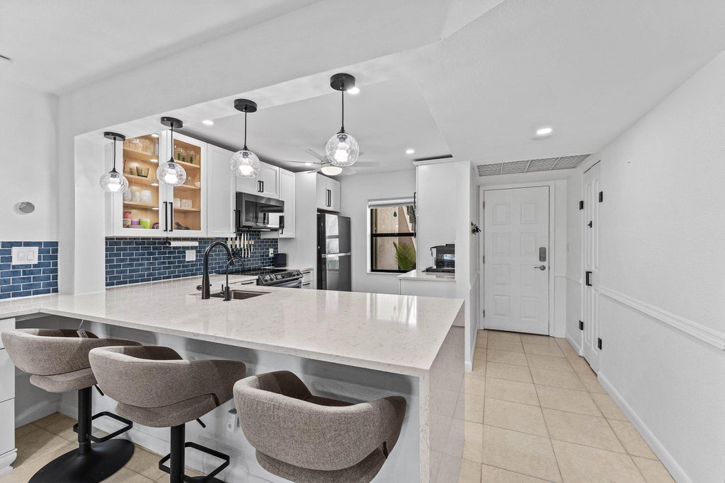 Photo of 8414 Boca Glades Boulevard E, Boca Raton, FL 33434 (MLS # B26068970)