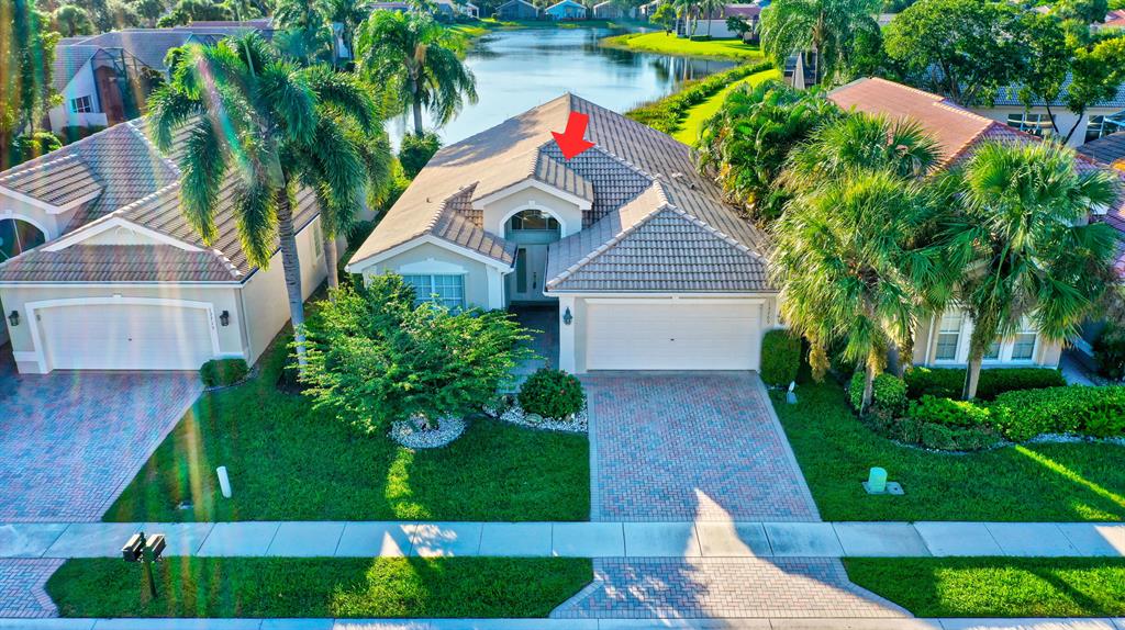 BEAUTIFUL FURNISHED HOME SITUATED ON ONE OF THE MOST PREMIUM LAKE LOTS W/DELIGHTFUL LONG LAKE VIEWS! MAGNIFICENT PACIFIC MODEL OFFERS TASTEFULL UPGRADES THROUGHOUT. SELLER EXTENDED GARGE 2 FEET. AS YOU PULL UP TO THIS HOME YOU WILL SEE SUPERIOR LANDSCAPING/TREES SURROUNDING HOME. QUALITY LARGE COACH LIGHTS ON GARAGE & DECORATIVE SIDELIGHT AT ENTRY. HOME EQUIPPED WITH ACCORDION HURRICANE SHUTTERS & NEW CARPETING IN 3 BEDROOMS INSTALLED 2021. DESIGNER FIXTURES W/LIGHTED WALL SCONCES IN DR & LIGHTING THROUGHOUT PLUS NEUTRAL TILE ON DIAGONAL. KITCHEN OFFERS 42'' CABINETS, CORIAN COUNTERS, FULL TILE BACK SPLASH, LARGE SINK UPGRADED FAUCET & LARGE KITCHEN WINDOW FOR NATURAL LIGHT. COME ENJOY THE STUNNING SUNSETS FROM THE EXTENDED SCREENED IN PATIO.