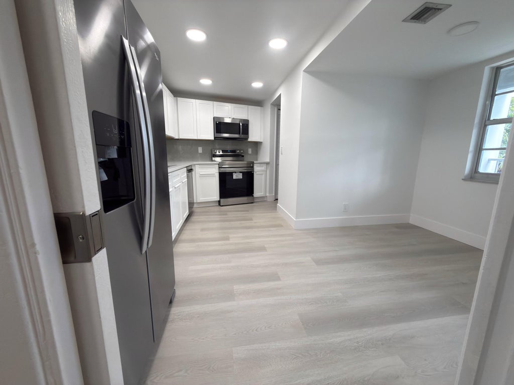 Photo of 625 Oaks Drive #305, Pompano Beach, FL 33069 (MLS # B26046987)