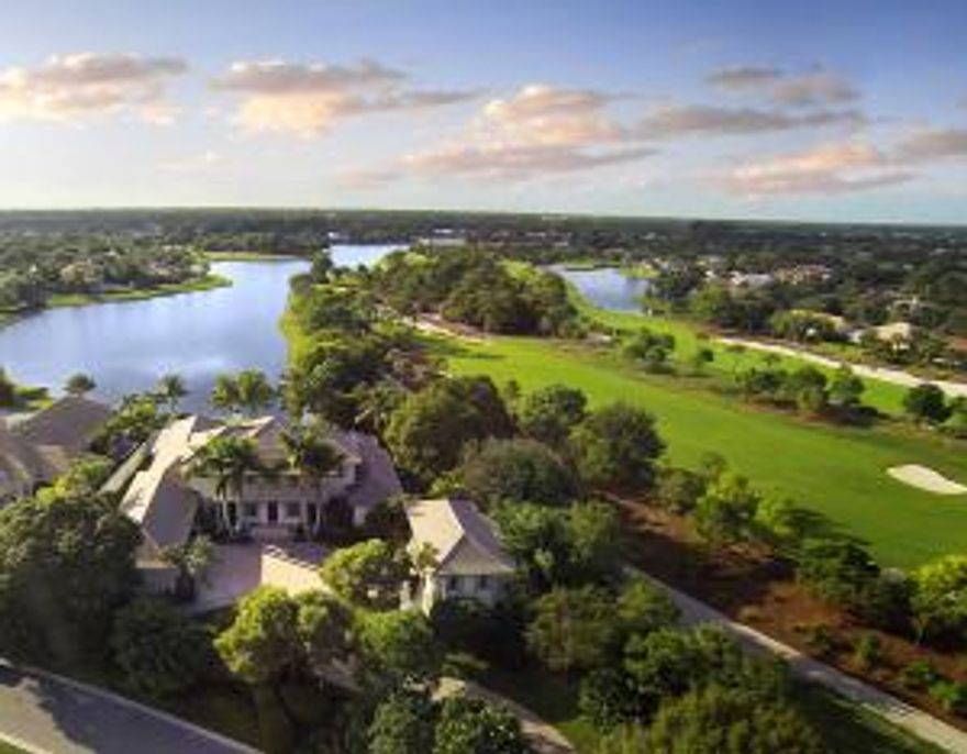 Perfectly situated on a lakefront 1 acre site in The Loxahatchee Club, this stunning estate features a 2 story main residence w/ elevator, theatre, library, infinity pool,spa,& summer kitchen. Upstairs and downstairs Master suites and first floor bedroom with adjoining office(which could be used as fourth bedroom)in Main House and 2 story 3 bedroom Guest house w/ elevator. A must see! Perfect family compound for entertaining. Spacious paved pool deck with heated infinity pool and oversized spa, summer kitchen, screened lanai with stone flooring and retractable hurricane shutters. Additional features include Anderson impact windows and doors, 60 kw generator,5 zoned air- conditioned units, including garage..