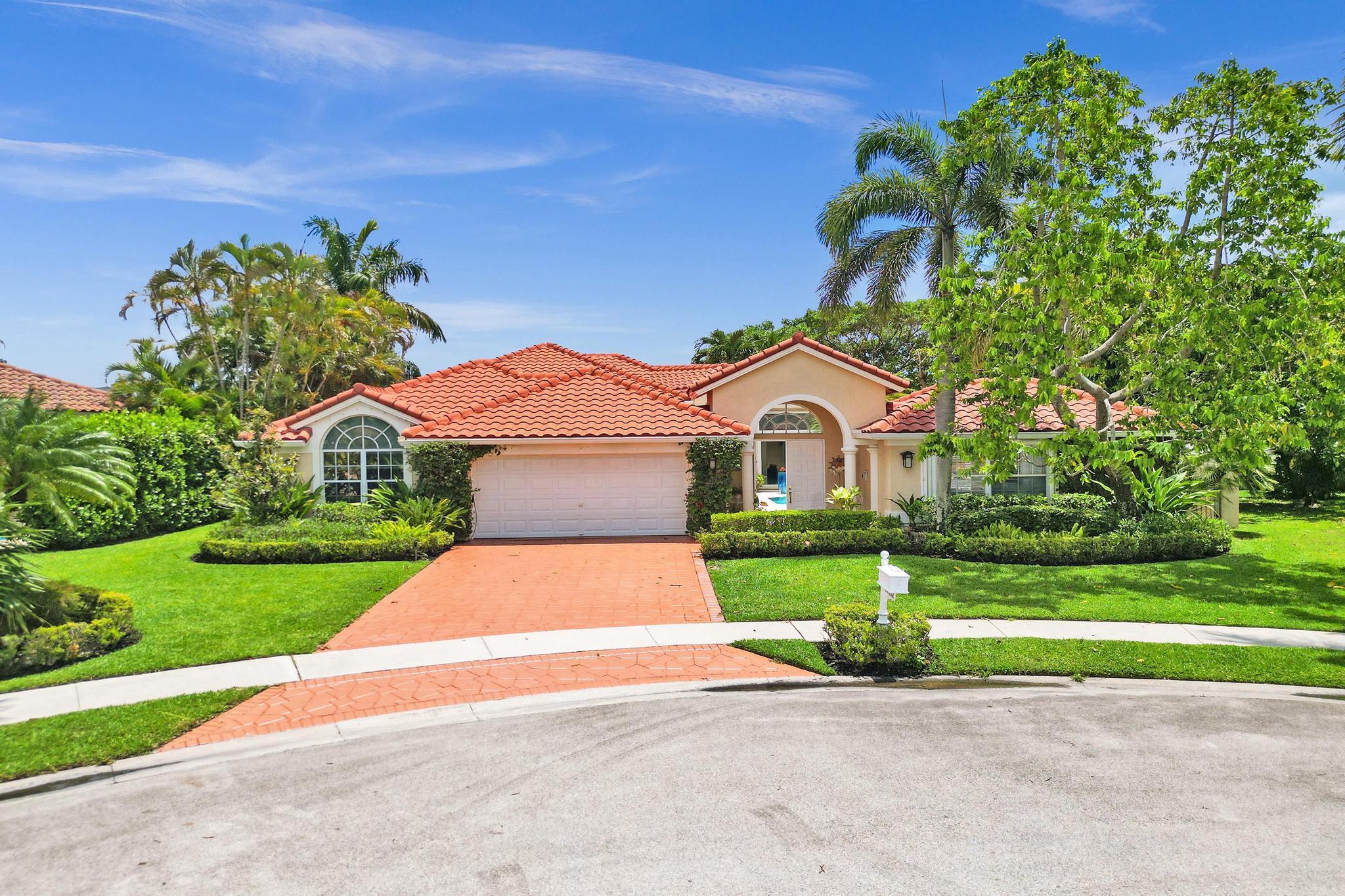 Discover this exceptional Boca Raton lakefront home in the gated community of Boca Isles North. This courtyard-style single-family home offers 3 bedrooms and 2 bathrooms in the main residence plus a separate guest house with private bedroom and full cabana bath--perfect for visitors or a home office. Enjoy breathtaking lake views, volume ceilings, and abundant natural light throughout. 2017 roof, accordion shutters with some impact sliders, and all updated bathrooms. The gourmet kitchen features a Wolf gas cooktop.Situated on a large cul-de-sac lot with salt-water pool, this tropical oasis is surrounded by gardenias, magnolias, mango, and banana trees,24-hour gated, newly renovated clubhouse, resort style pool, fitness center and tennis courts. Zoned for top rated Boca Raton schools.