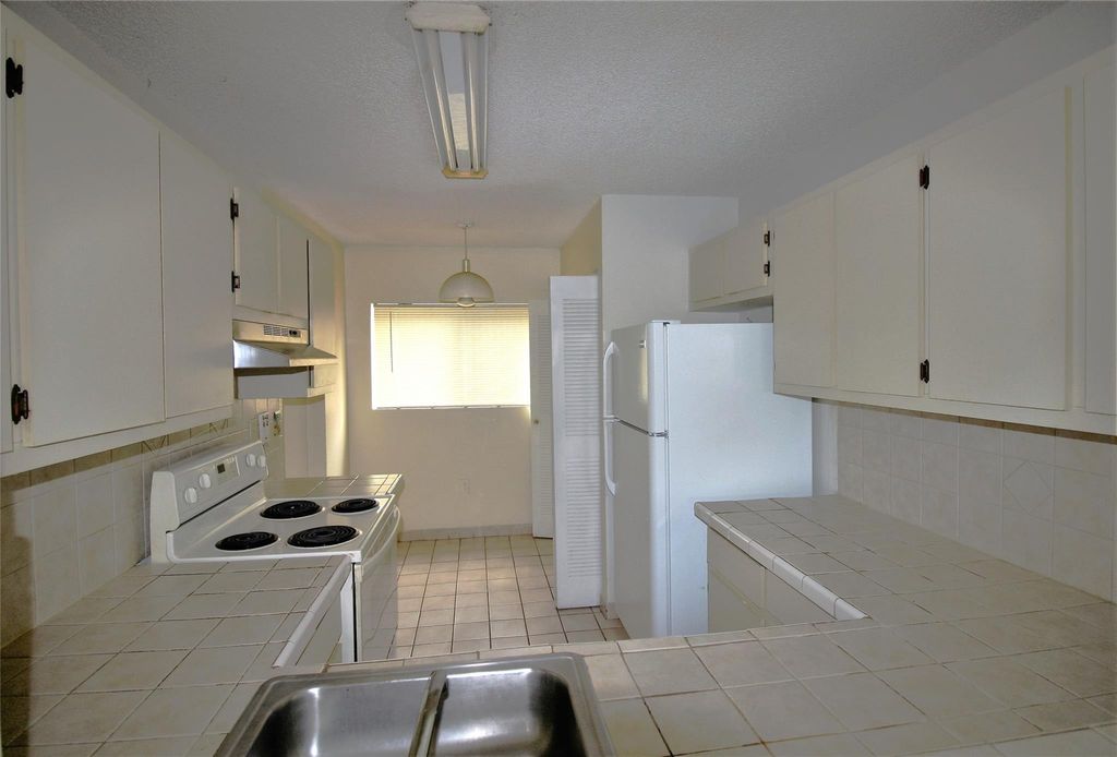Photo of 9477 Palm Circle, Pembroke Pines, FL 33025 (MLS # F10550046)