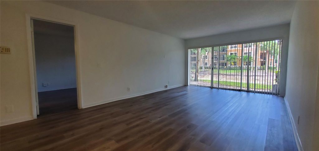 Photo of 8781 Wiles Road #104, Coral Springs, FL 33067 (MLS # F10514489)