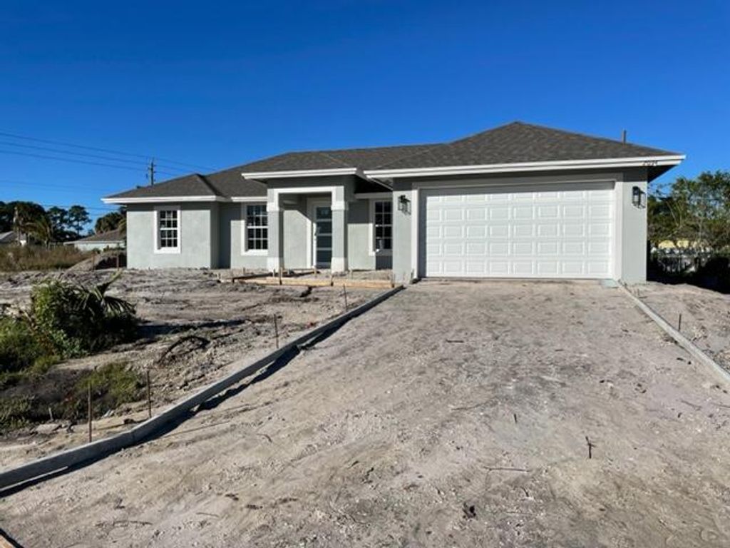 Photo of 2094 SW Capeador Street St, Port St Lucie, FL 34953 (MLS # R10773354)