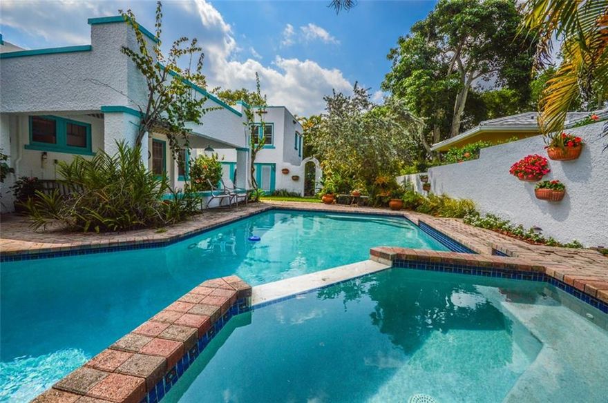 Reduced! Rio Vista Spanish Eclectic original is positively charming. Fantastic 8th street location and a large lot (75x125). The 2/2 main house, 1/1 guest house with a sun deck and the gorgeous pool area are perfect for entertaining. The main house has original wood floors, two wood burning fireplaces and a bright white kitchen opening to the living areas. The outdoor areas offer a spa/pool with a lovely waterfall feature, outdoor covered dining, and a walled meditation garden.