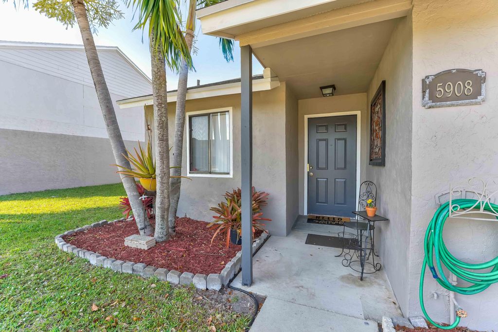 Photo of 5908 Channel Drive, Greenacres, FL 33463 (MLS # R10868615)