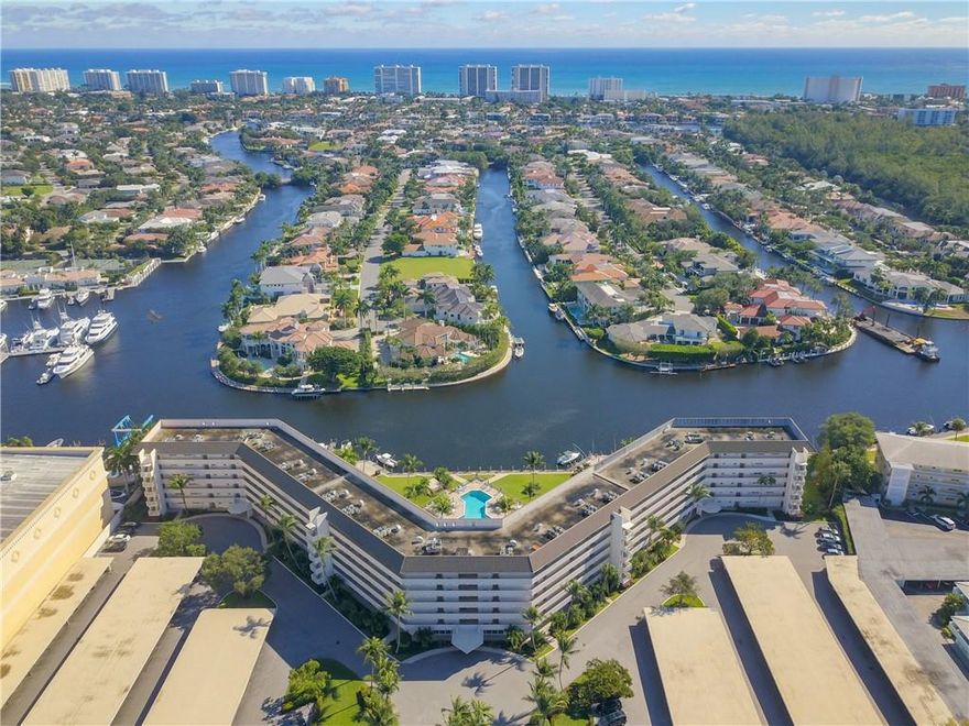 As soon as you enter the unit, the unobstructed water view will entice you to the balcony to see water in every direction, a pool below you and multi-million-dollar homes across the canal in the Royal Palm Yacht and Country Club. This unit has been totally updated, including hurricane windows and front door. 40-year inspection has been done, the roof is currently being replaced, all other repairs have been completed and seller has paid the special assessment in full. Documentation available upon request. Boat dockage rents for $80 for 23' boat & $120 mo for 35' boat when available.  One assigned covered carport for your car and ample guest parking for 2nd car. Laundry room and bicycle room are 1 & 2 doors away.