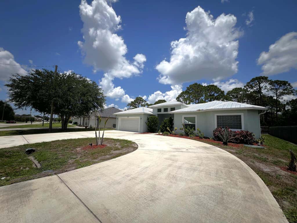 Photo of 349 SW Dagget Avenue, Port Saint Lucie, FL 34953 (MLS # B26047436)