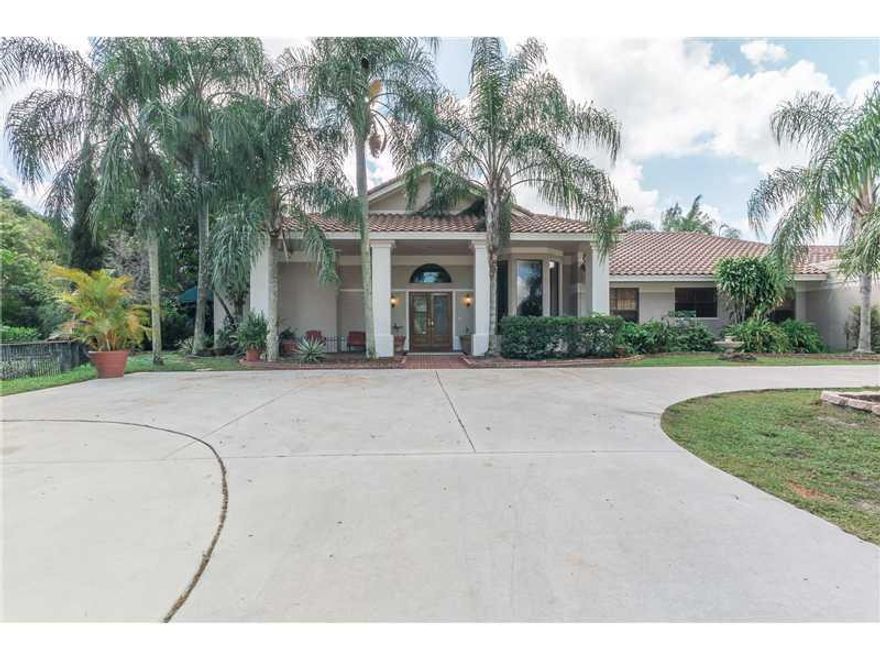 One of kind opportunity to own in exclusive BBB Ranches in Parkland. Over 5,000 sq. ft. under A/C home located on 5.5 Acres. Amazing property with a 6 stall barn, lighted tennis court, several ponds, over sized pool area, Gazebo Bar, walking paths, detach ed 4 car garage. Only lots 1&2 are included in sale. Lot 2 could potentially be subdivided and a 2nd home built (Zoned 1 home per 2.5 acres.