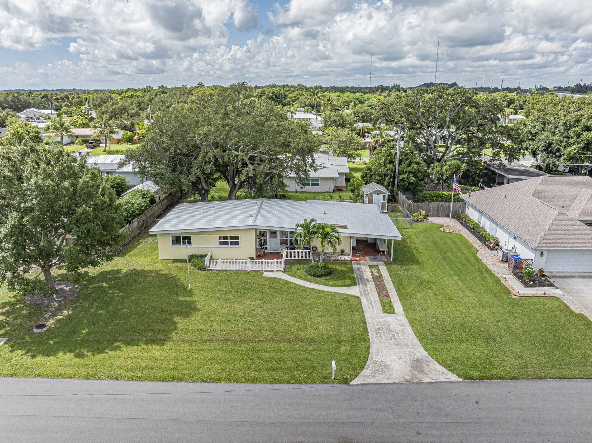 Old Florida charmer surrounded by wispy palms in a riverfront community! Located in the desirable Vero Shores community, this 3/2 + large den/office/4th bedroom home has no HOA restrictions, making it a classic choice for an investor's portfolio, or a local first time home buyer looking to take advantage of the Hometown Heroes down payment + closing cost assistance program. Partially fenced yard with brick paver patio and spacious utility shed. 2021 metal roof, brand new 2025 A/C + repiped with PEX plumbing. A little TLC will make you have FOMO if you skip it!