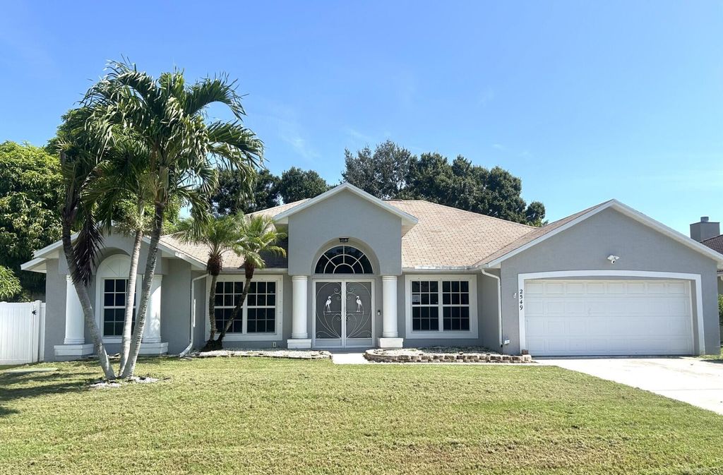 Photo of 2549 SE Tiger Avenue, Port Saint Lucie, FL 34952 (MLS # R11107389)