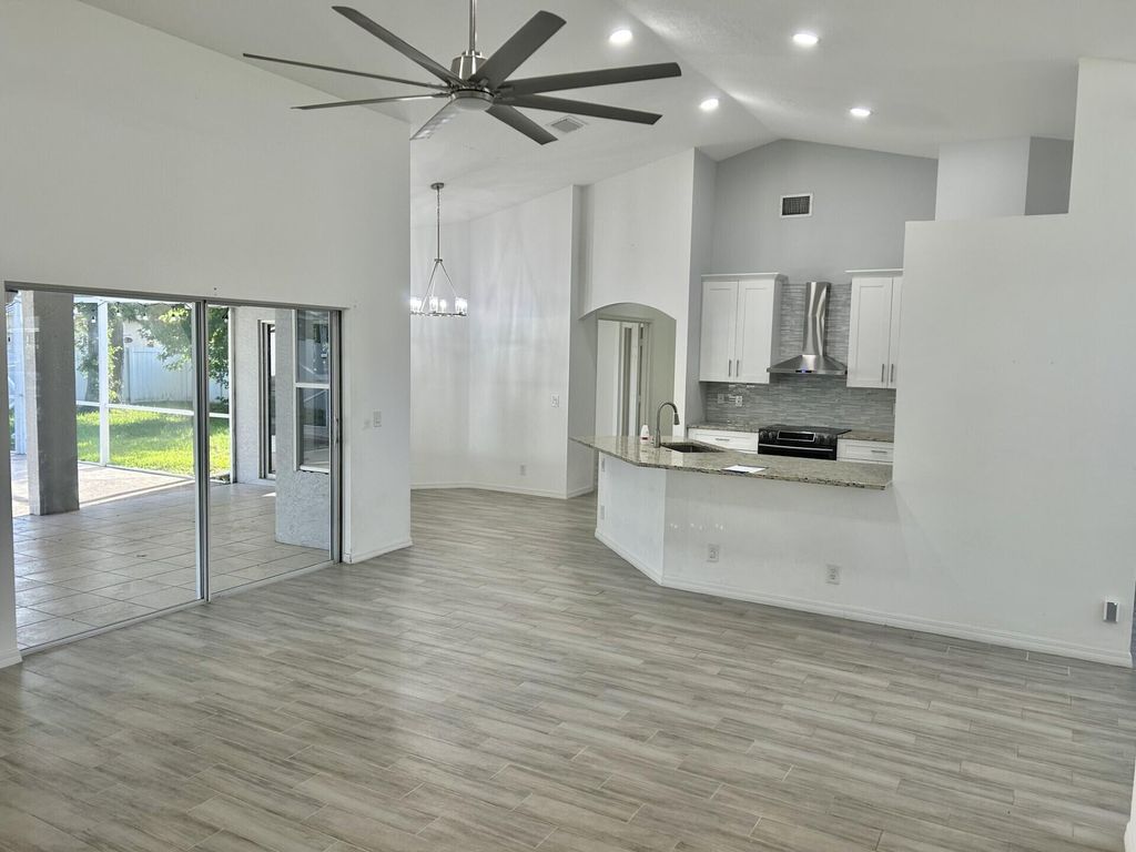 Photo of 2549 SE Tiger Avenue, Port Saint Lucie, FL 34952 (MLS # R11107389)