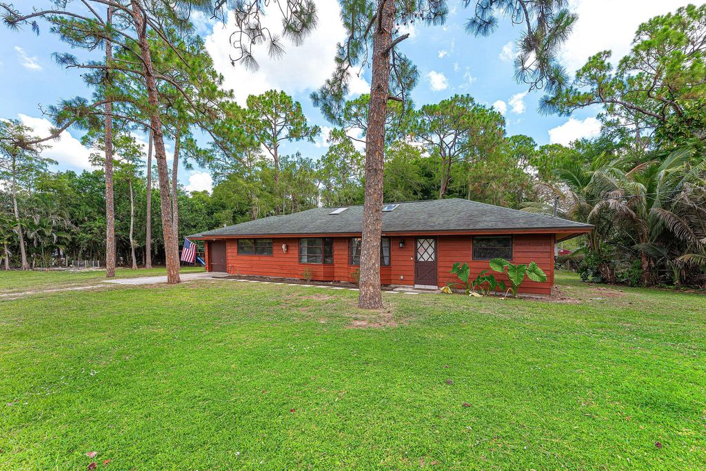 Photo of 16355 Lancashire Drive E, Loxahatchee, FL 33470 (MLS # B26041501)