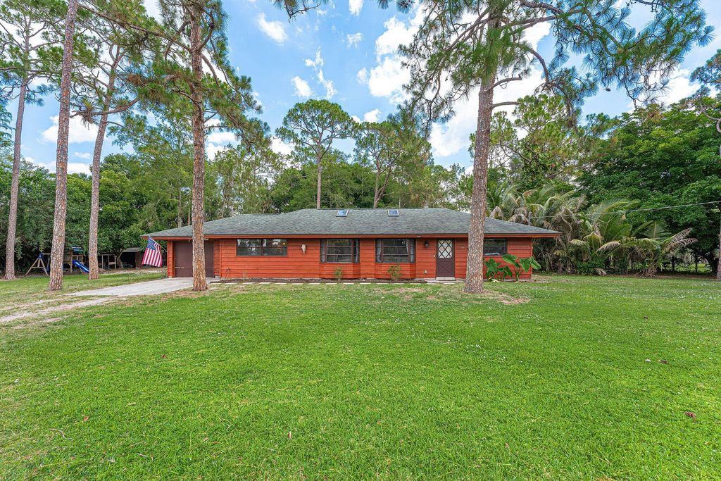 Photo of 16355 Lancashire Drive E, Loxahatchee, FL 33470 (MLS # B26041501)