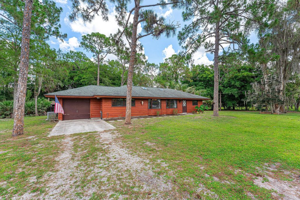 Photo of 16355 Lancashire Drive E, Loxahatchee, FL 33470 (MLS # B26041501)