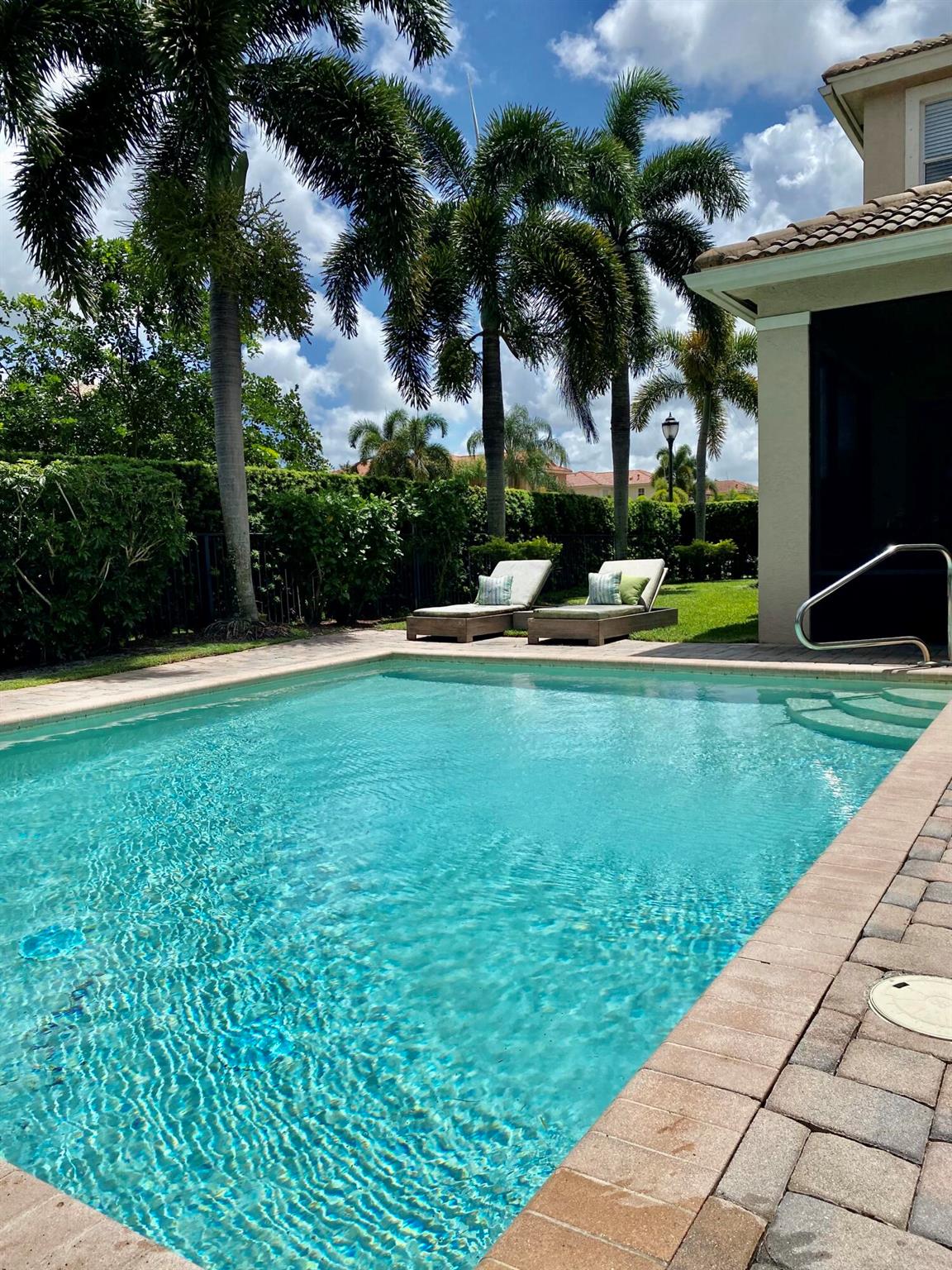 YOUR PERFECT HOME AWAITS! Come experience Palm Beach Gardens at its finest.This Beautiful Bright 4 bedroom/2.5 bathroom home is situated on an over sized private lot with PRIVATE POOL and screened lanai area. This property features an open floor plan, gourmet kitchen with stainless steel appliances, granite counter tops and a kitchen island ideal for entertaining. Sliders open into screened lanai area and serene private pool. Upgrades include plantation shutters, custom closets, ceramic porcelain tile downstairs and hardwood flooring on stairs and second floor. Mirabella features a 24 hr manned gate, gym, community pool, kids play area and clay tennis courts... All situated close to the areas best beaches, restaurants, golf courses, shopping and schools. Hurry this one wont last!