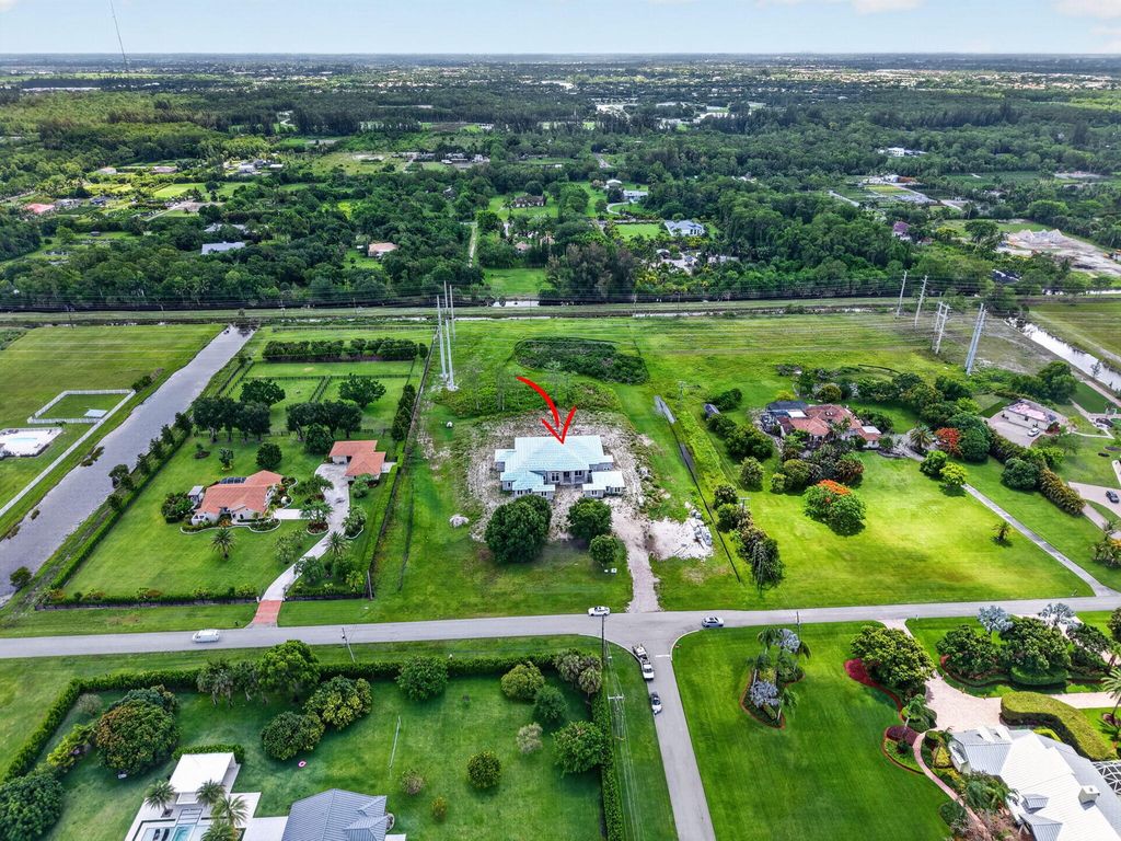 Photo of 6450 Sugarcane Lane, Lake Worth, FL 33449 (MLS # B26042499)