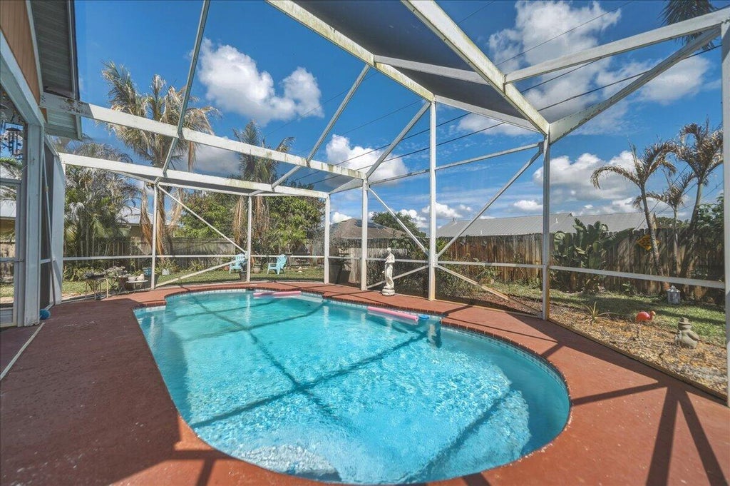 Photo of 437 SW Kaabe Avenue, Port Saint Lucie, FL 34953 (MLS # B26041411)