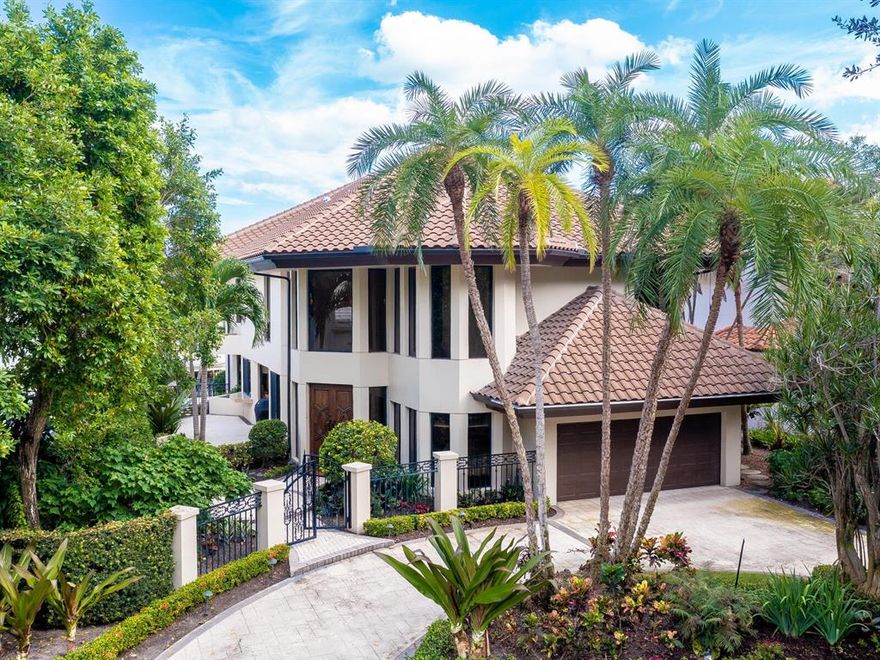 BEAUTIFULLY UPDATED WATERFRONT HOME ON OVERSIZED LOT IN BOCA MARINA YACHT CLUB. DIRECT OCEAN ACCESS WITH NO FIXED BRIDGES FROM IT'S PRIVATE 50' DOCK.  UPGRADES THROUGHOUT TO INCLUDE A CHEF'S KITCHEN , SUB-ZERO REFRIGERATOR, STAINLESS STEEL APPLIANCES, CUSTOM CABINETRY AND BUILT IN BAR AREA 10 1/2' CEILINGS ON MAIN FLOOR, SPACIOUS ROOMS, 37 X 21 LIVING ROOM FEATURING TRAY CEILING WITH WET BAR AND ADJOINING DINING ROOM WITH DOORS THAT OPEN TO ONE OF THREE WATERSIDE PATIO AREAS. LARGE MASTER SUITE WITH SITTING ROOM,  WALK IN CLOSETS AND MARBLE BATH WITH SEPARATE SHOWER.DOUBLE DOOR FRONT ENTRANCE THROUGH IMPORTED BRAZILIAN WALNUT DOORS TO ENTER TWO STORY FOYER WITH WOOD FLOORS AND STUNNING STAIRCASE. HOME HAS AN ELEVATOR, IMPACT WINDOWS, AC & ROOF REPLACED 2018.