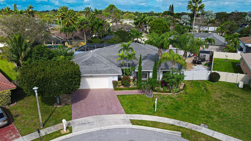 !!PRICE REDUCED!! SELLER MOTIVATED! Experience the spacious grandeur of this residence, situated in a peaceful cul-de-sac. Located in the Heart of Wellington, HARD TO FIND WITH NO HOA sitting on an oversized lot with ample parking space BRING YOUR BOAT. Beautifully landscaped backyard, complete with artificial turf for easy maintenance, sets the stage for relaxation. The master bedroom offers a serene escape, while the heated pool beckons year-round enjoyment, complemented by a convenient cabana bath. Simplify daily tasks in the separate laundry room, equipped with a handy wash sink. Step into the screened pool area for outdoor comfort and leisure. Plus, an expansive formal dining room adds an elegant touch to your gatherings. And don't forget the generously sized two-car garage, enhancing the convenience of this fantastic home.