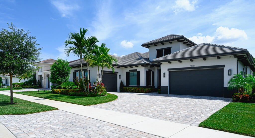 Photo of 9228 CORAL ISLES Circle, Palm Beach Gardens, FL 33412 (MLS # B26068594)