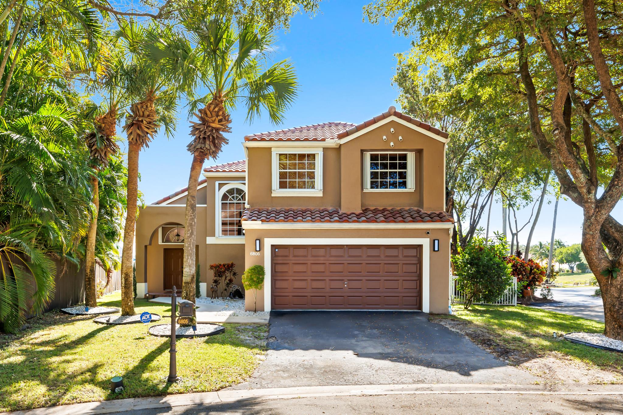 Tucked at the end of a quiet cul-de-sac in one of Parkland's most desirable gated communities, this 4-bedroom, 2.5-bath lakefront pool home offers the perfect combination of comfort, style, and location.Step inside to an open and inviting layout with a recently updated kitchen featuring white cabinetry, quartz countertops, matching backsplash, and stainless steel appliances--ideal for everyday living and entertaining. All bathrooms have been upgraded with quartz counters, undermount sinks, modern faucets, and new commodes for a clean, contemporary feel.Enjoy the living here with a fully renovated pool and deck, overlooking serene lake views and taking strolls around the neighborhood. The fenced backyard offers plenty of space for outdoor gatherings or quiet relaxation by the water.
